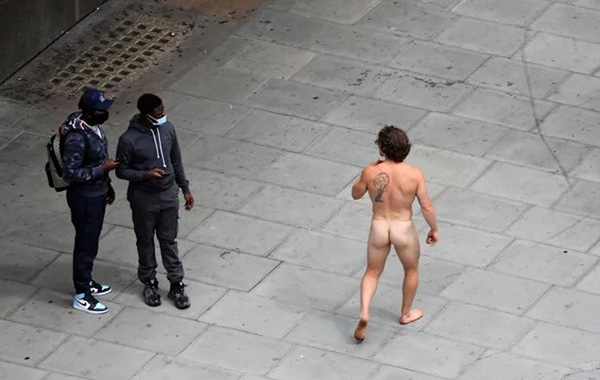 This Muscular Athlete Strolled Down Oxford Street Wearing Nothing But a Face Mask as G-String!